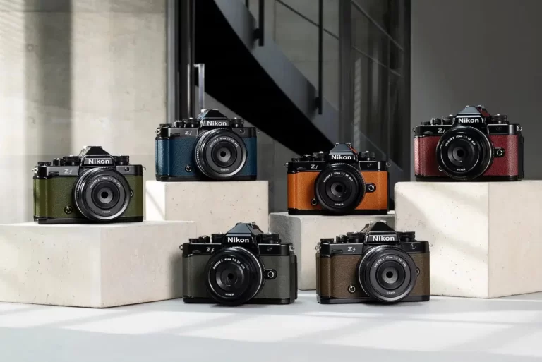 a group of cameras on a white surface